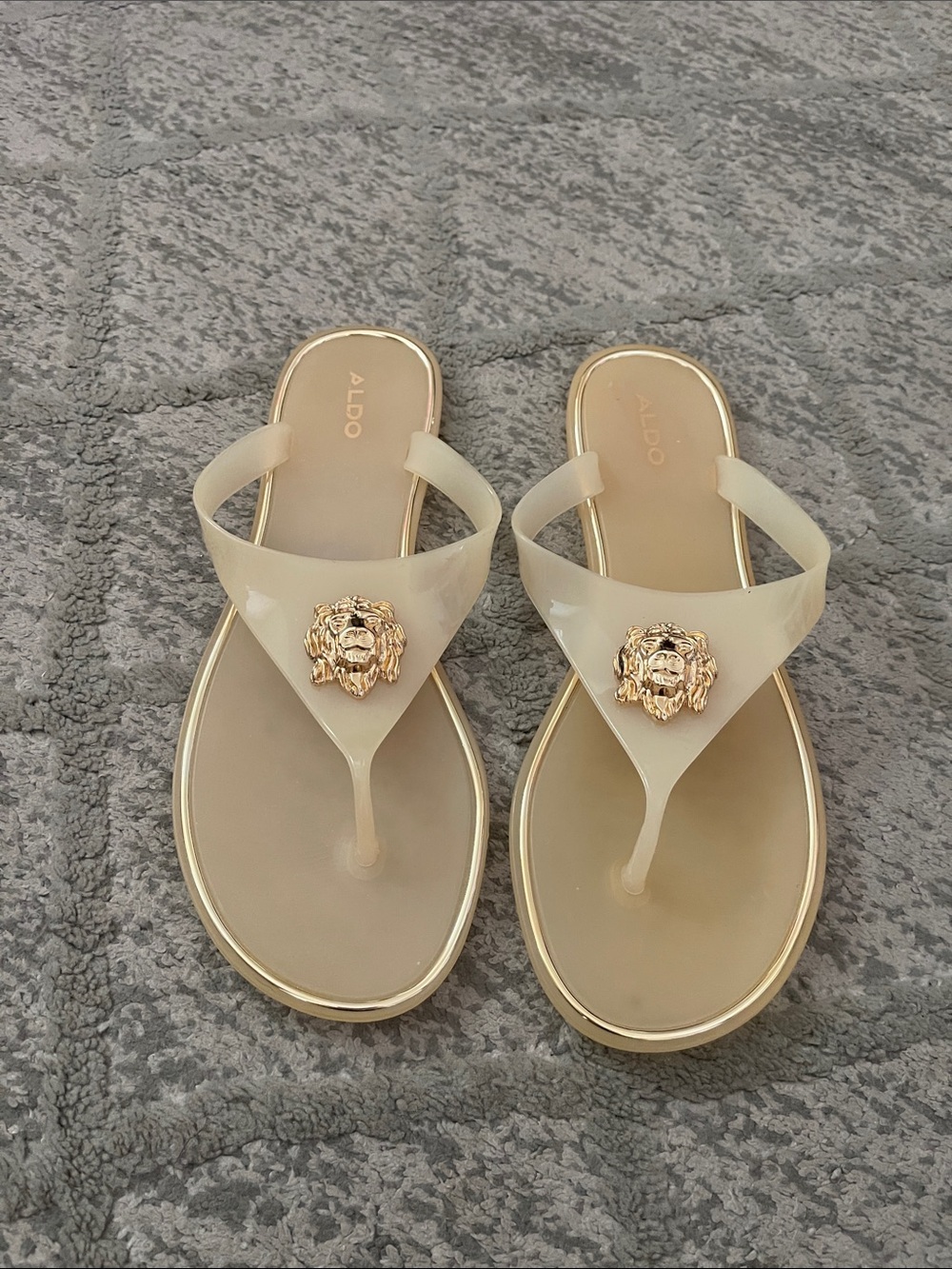 ALDO Cream Jelly Thong Sandals with Gold Lion Emblem